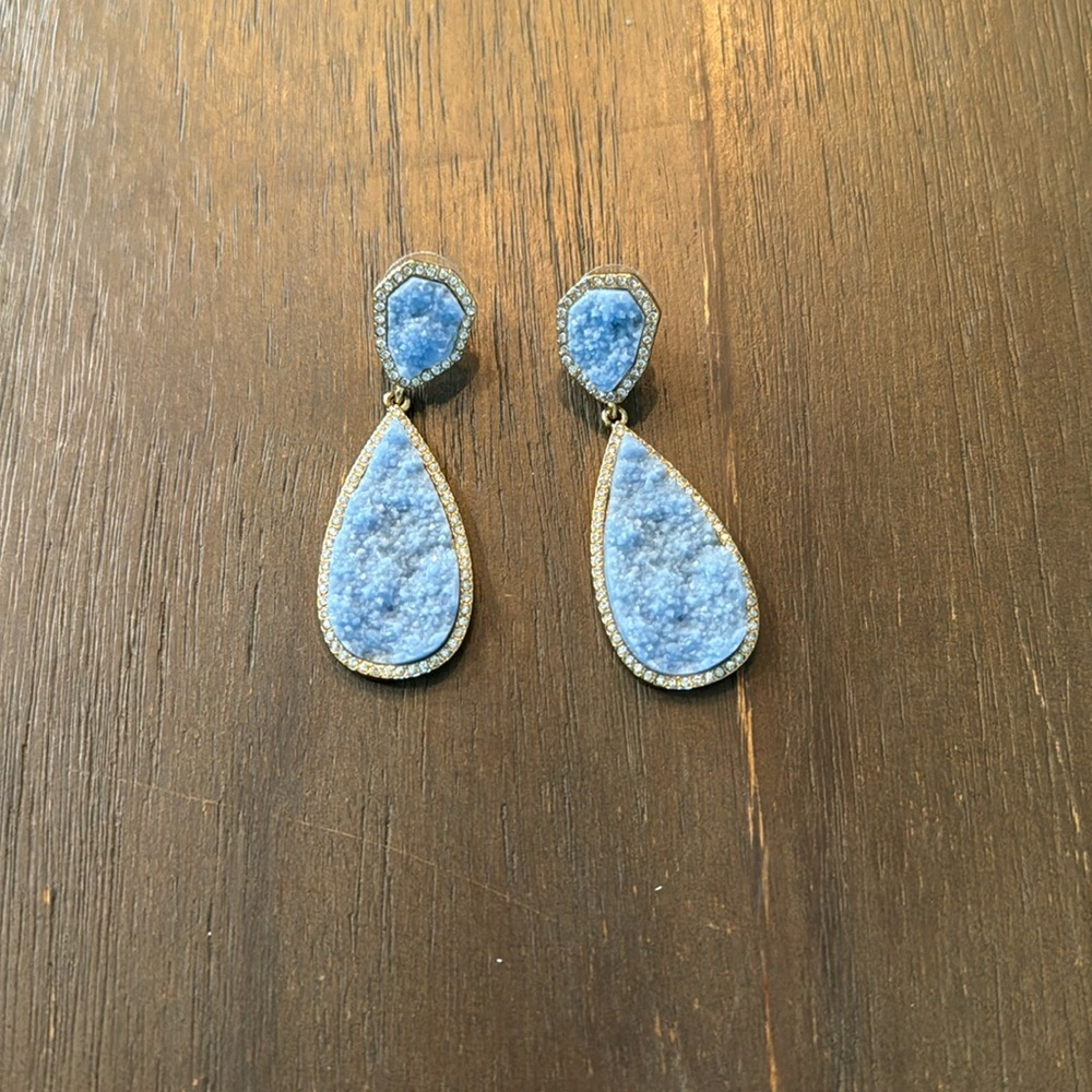 Light blue statement earring.